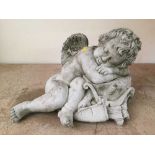 A garden figure - sleeping cherub