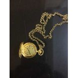 A gilt metal Rotary fob watch upon 9ct gold chain, the chain weighing 12.