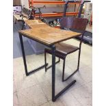 A mid 20th century school desk and chair