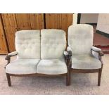 Two piece wood framed lounge suite in a beige button fabric