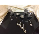 A box of assorted plated ware including fighting cockerils, apostle spoons,