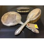 A silver backed hand brush,