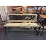 A wrought iron and reclaimed pine bench