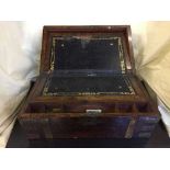 A Victorian rosewood brass bound writing box