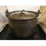 An antique brass pan with lid