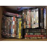 A box of assorted DVDs