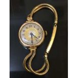 A lady's 9ct gold wristwatch on 9ct gold strap, 22.