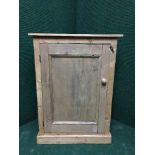 A reclaimed pine small cupboard