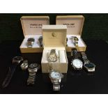 A collection of lady's and gent's wrist watches including two boxed sets of Swiss Line watches