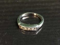 An 18ct white gold diamond five stone ring, 4.