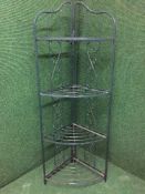 A metal four tier folding corner stand