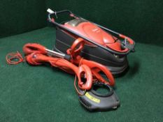 A Flymo Turbo Compact 330 lawn mower and two strimmers
