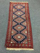A fringed Persian rug,