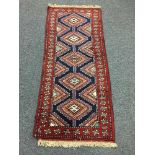 A fringed Persian rug,