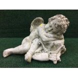 A garden figure - sleeping cherub