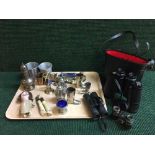 A tray of binoculars, pair of opera glasses, jar of coins, plated cutlery,