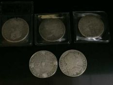 Four Charles II crowns; 1673 (X2), 1677 and 1682. Together with a Queen Anne crown, 1708.