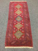 A Persian fringed woolen rug,