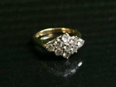 An 18ct gold 9 stone diamond ring, approx 1.