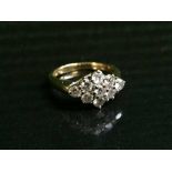 An 18ct gold 9 stone diamond ring, approx 1.