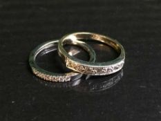 Two 9ct gold and diamond half hoop rings