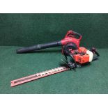 A Toro petrol leaf blower together with a Castor petrol hedge trimmer