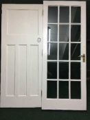 Two painted panel interior doors and an interior door set fifteen glass panels