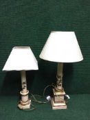 A pair of cream and gilt table lamps with floral decoration