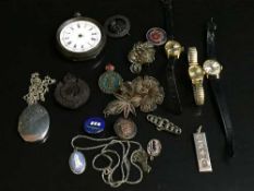 A silver locket on chain, silver Wedgwood pendant, silver ingot, brooches, enamel badges,