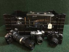 A box of cameras including Zenit, Helena, Minolta etc,