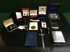 A collection of assorted cufflinks, Navy dress buttons, cigarette case,