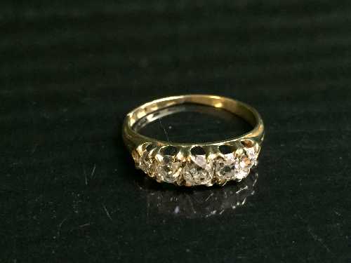 An 18ct gold five stone diamond ring