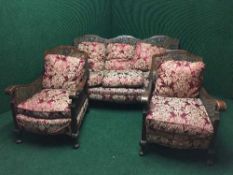 A walnut framed three piece begere lounge suite
