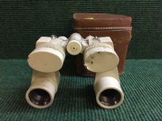 A pair of Daiichi Seimitsu Kogyo binoculars in leather case