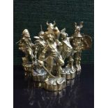 A set of heavy brass figural paperweights