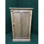 A pine single door cupboard