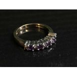 A 9ct gold amethyst and diamond half hoop ring