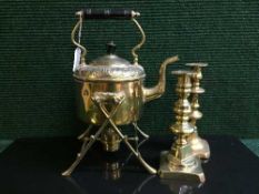 A brass spirit kettle on stand with burner together with a pair of brass candlesticks