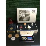 A boxed set of Mercedes Benz branded wine stoppers, TSB money bank and coins,