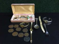 A box of crested spoon, plated pickle fork, lady's brooch,