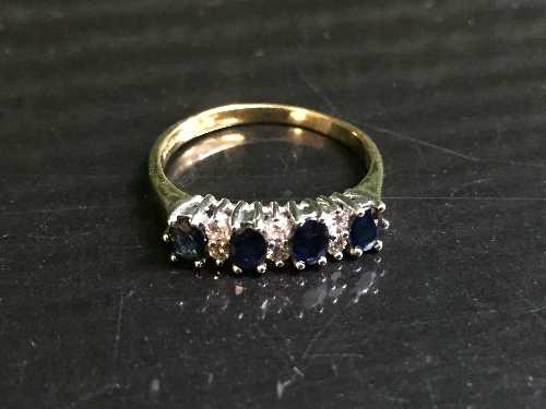 An 18ct gold sapphire and diamond half hoop ring