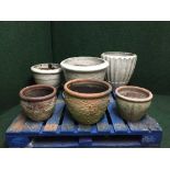 Six assorted circular garden planters