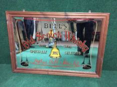 A pine framed Bells Old Scotch whisky advertising mirror
