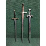 Three fantasy broad swords.