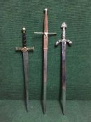 Three fantasy broad swords.