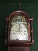 A nineteenth century mahogany longcased clock with painted dial, pendulum,