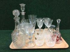 A tray of glass decanters, comports,