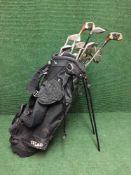 A Texan golf bag and a set of Wilson Ping Seeker irons, assorted drivers,