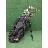 A Texan golf bag and a set of Wilson Ping Seeker irons, assorted drivers,