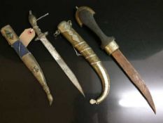 Two Eastern Jambiya daggers in sheaths